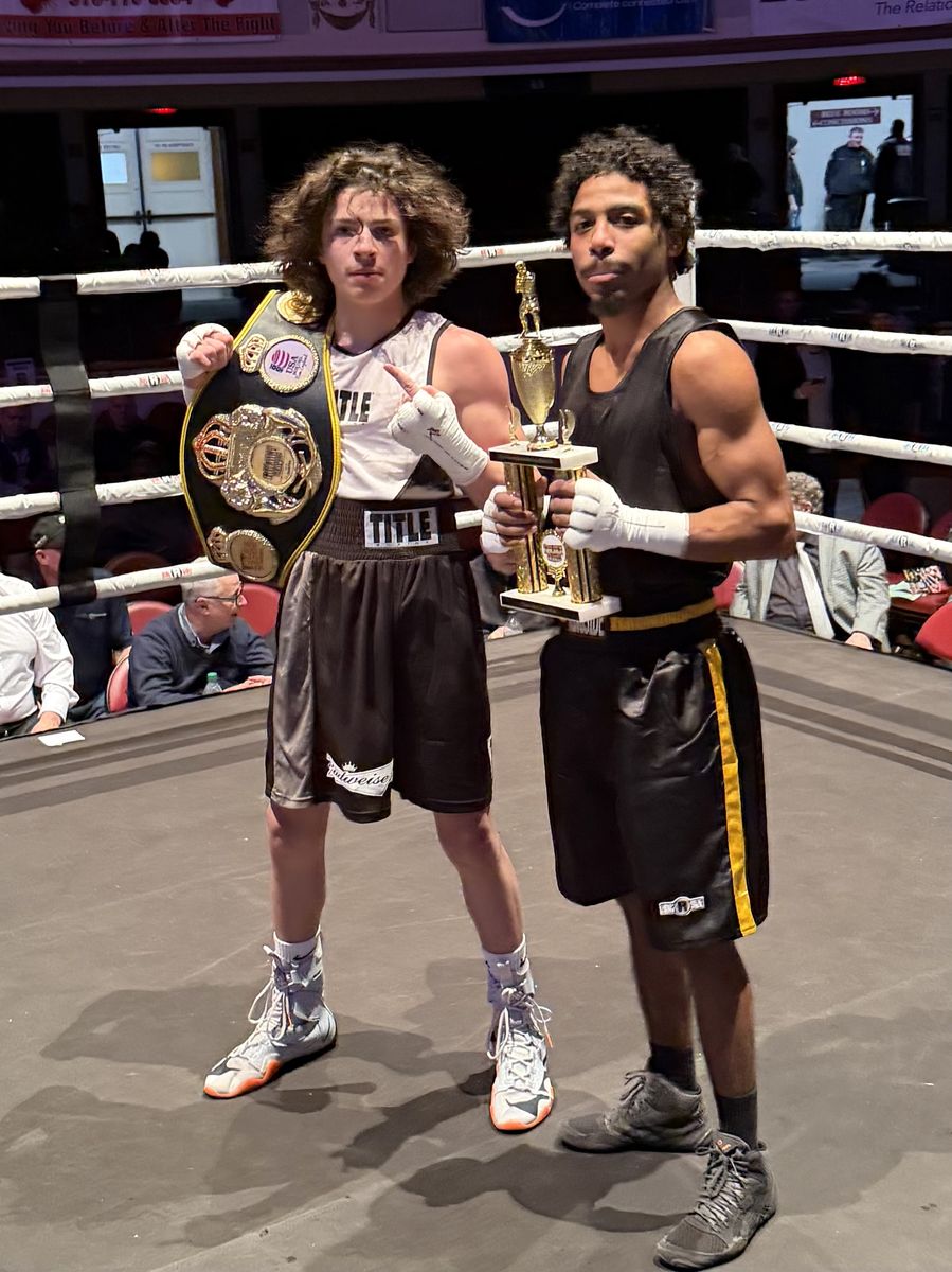 Manfredo fighters with belt and trophy