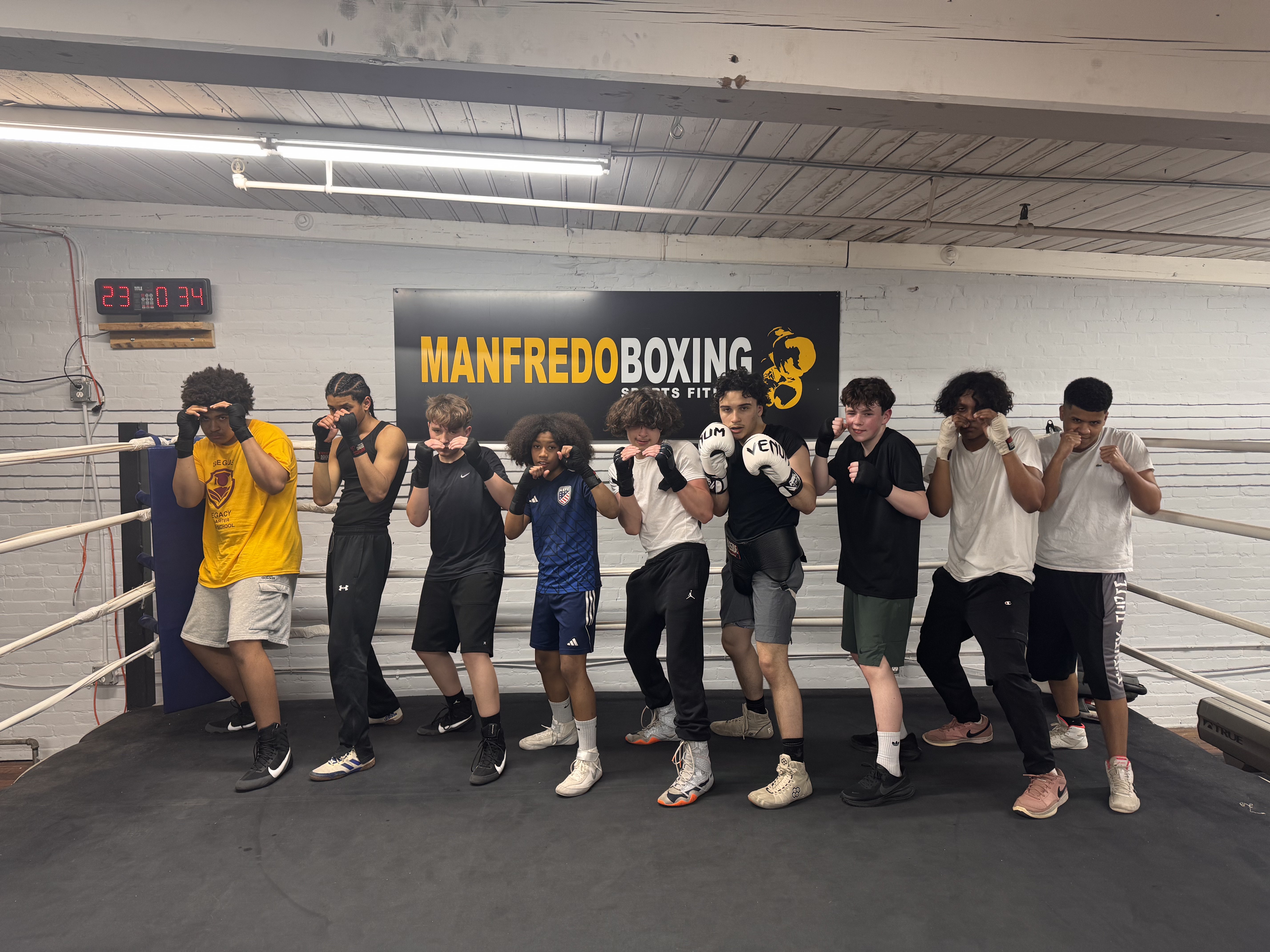 Fighters lined up in the ring at Manfredo Boxing