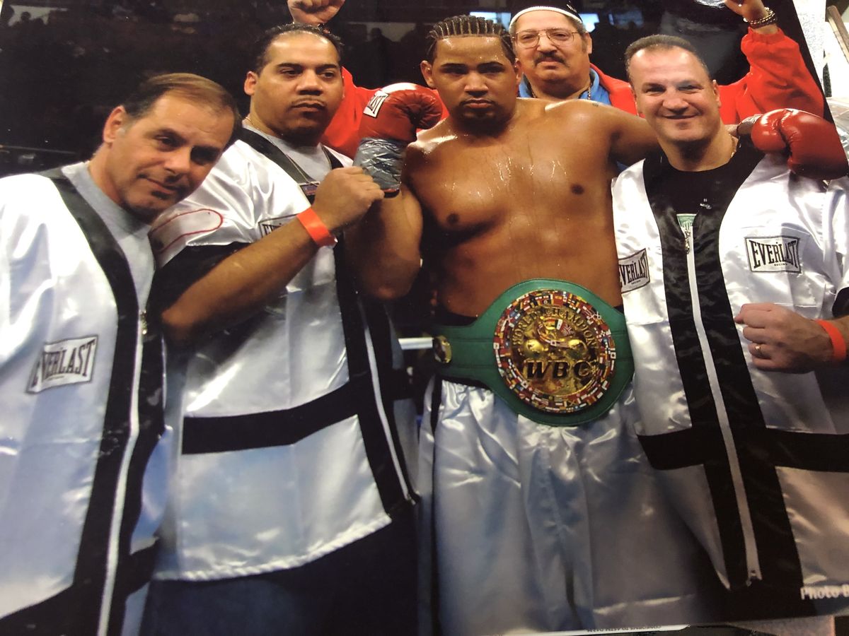 Peter Manfredo Sr. with fighter and WBC championship belt